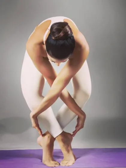 The desire for symmetry, for balance, for rhythm in form. This creative standing forward bend with crossed arms and legs is a beautiful exploration of lines and shapes.