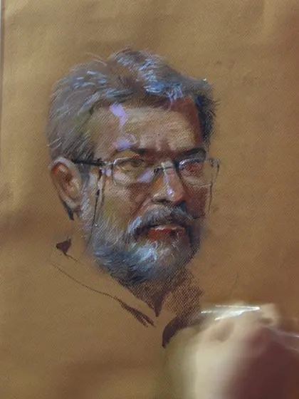 A close-up of the pastel portrait of my guru, Shri Vasudevji Kamath. You can see the fine details in the eyes and the texture of the beard, achieved through careful layering of colours.
