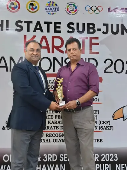 Receiving an award from Hanshi Bharat Sharma at the Delhi State Championship. His appointment as Interim President of the South Asian Karate Federation is a proud moment for all of us.