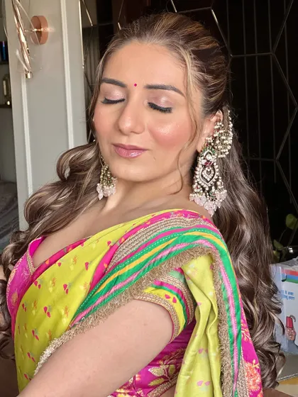 A close-up of the makeup for the Janiya function. The look is soft and radiant, with a focus on glowing skin and subtly defined eyes.