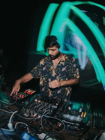 A long exposure shot capturing the movement and energy at the console. This is a visual representation of how it feels to be mixing for a live crowd.