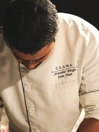 Our Sous Chef, Jitender Singh, meticulously plating a dish. His passion and attention to detail are a huge part of our success.