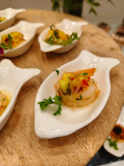 A chef’s kiss of balance. Tender prawn crowned with a bright tropical salsa that brings the freshness of herbs to every bite. Fine dining, one spoon at a time.