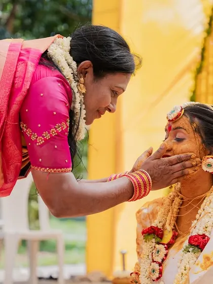 A mother's gentle touch during the Haldi ceremony. I focus on these small, meaningful interactions that represent a lifetime of love and blessings.