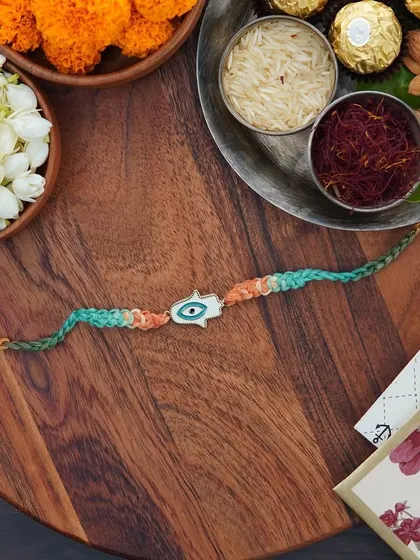 A flat-lay of the Hamsa Rakhi, ready for the festival.