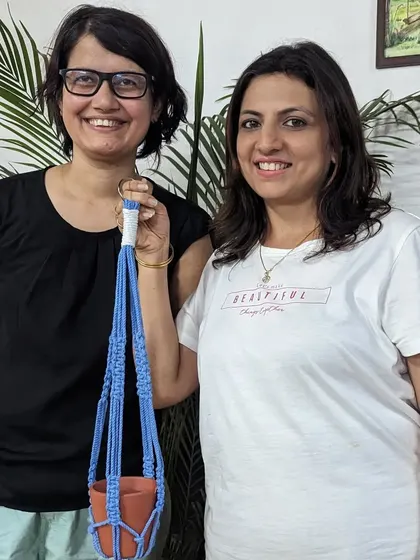 Our founder, Nisha, with a participant and her finished macrame plant hanger. Learn a few simple knots and create your own beautiful home decor.