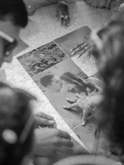 A beautiful, sentimental detail. We incorporated the couple's pre-wedding photos into the decor for guests to look at during the Haldi ceremony.