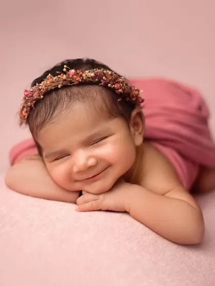 This is the kind of sleepy, peaceful smile that I live to capture. This little girl was an absolute dream, and her portrait shows the soft, artistic style I bring to every newborn session.