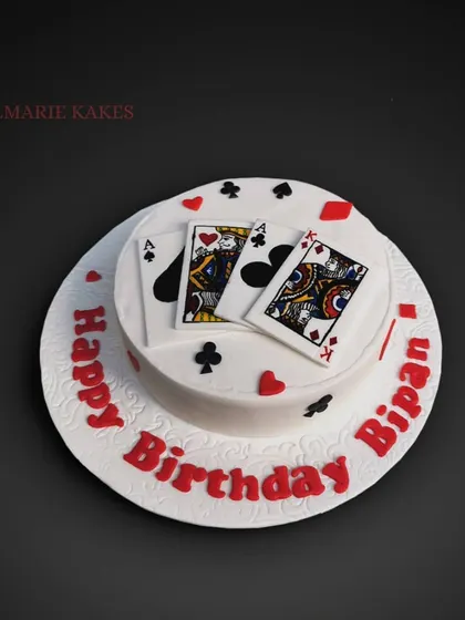 A winning hand for a birthday! This blueberry cake features meticulously hand-painted playing cards on top, perfect for someone who loves a game of poker.