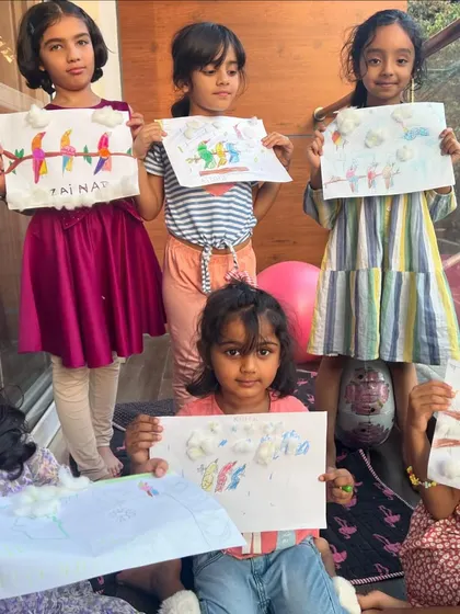 Look at these wonderful bird drawings. The kids used cotton balls to create fluffy clouds, adding a lovely 3D texture to their art.
