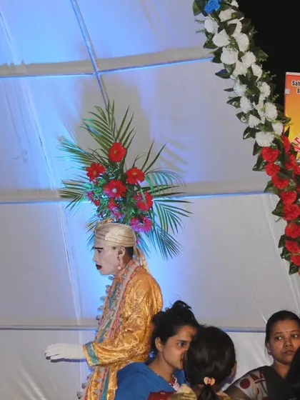 A member of our staff dressed as a 'dwarpal' or royal guard, adding a unique thematic touch to the wedding decor.