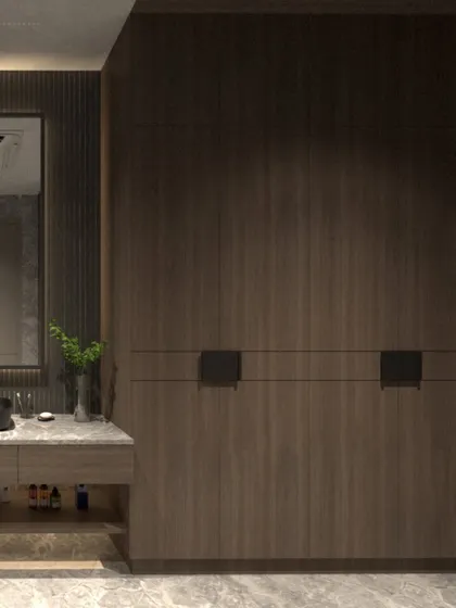 Another view of the villa bathroom, focusing on the custom wardrobe with integrated handles and its relationship to the vanity area. The design is all about clean lines and rich textures.
