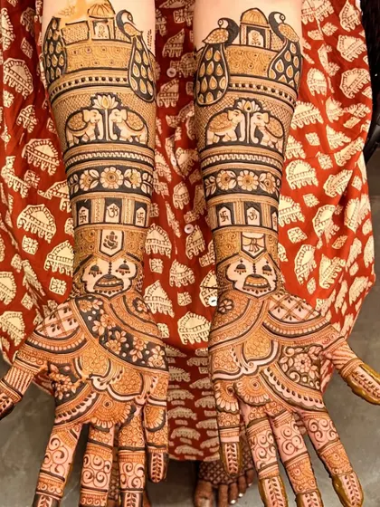 A complete bridal mehndi set telling a story with different elements on each arm, including auspicious symbols like Ganesh, kalash, and elephants.