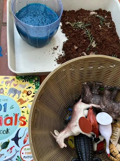Here are the simple, natural materials for our land and water animal sorting activity. We paired a beloved book with a basket of animal figures and our homemade sensory bases.