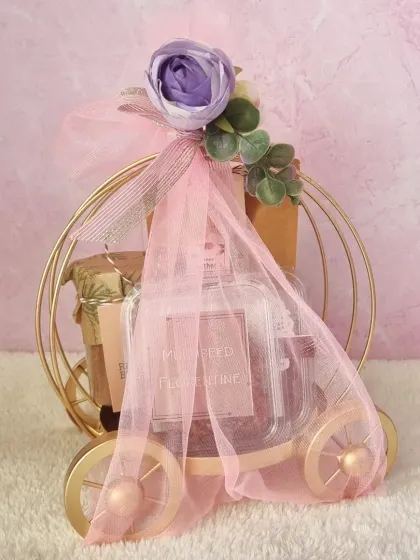A fairytale surprise. This golden carriage hamper is a whimsical and elegant way to present a gift, filled with our finest handmade cookies, cakes, and snacks.
