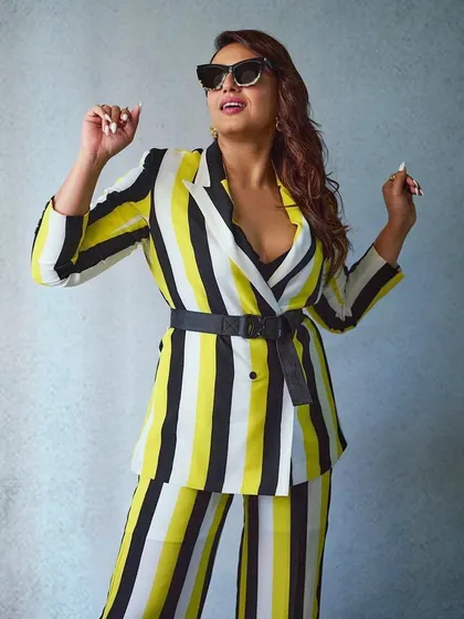A bold and graphic look for Huma Qureshi. This striped pantsuit from Cilvr Studio is all about making a statement. The belt cinches the waist and adds structure to the oversized blazer.