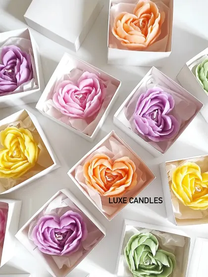 An array of colorful heart-shaped rose candles, boxed and ready to be gifted. They make for a vibrant and romantic party favor.