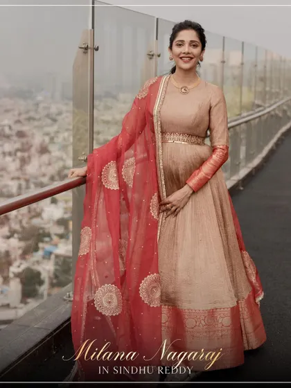 A stunning shot of Milana Nagaraj in our custom Anarkali, with the city skyline as her backdrop.