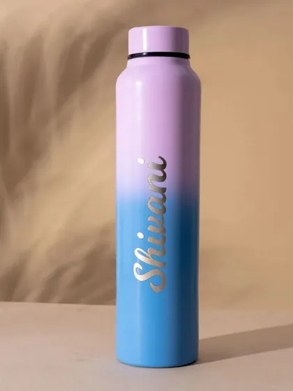 A single shot of the dual-tone bottle, showing the beautiful purple and blue gradient. The name is engraved in a stylish silver font, creating a premium look.