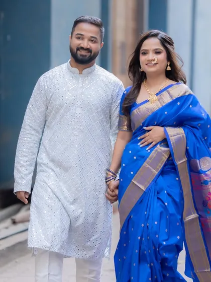Walking hand-in-hand. The bride's makeup is fresh and radiant, perfect for this happy occasion.