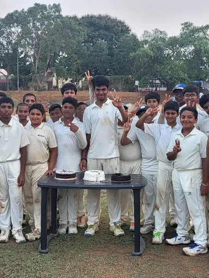 A moment of celebration during the Hyderabad tour, with the team gathered around a cake.
