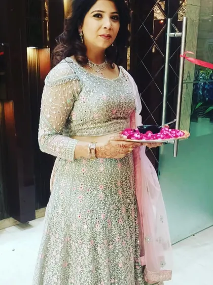 A graceful pose from a client in the mint green lehenga. It’s a popular rental choice for its subtle colors and intricate work.