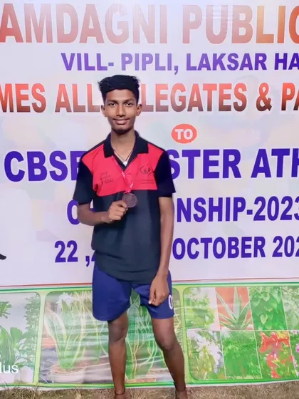 Our athlete proudly displaying his bronze medal from the CBSE Cluster Athletics competition.