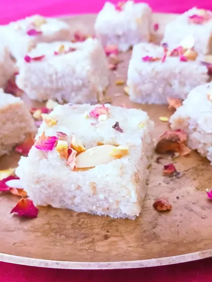 My vegan Kalakand, made without any dairy, refined sugar, or oil. It's soft, delicate, and garnished with rose petals, perfect for Diwali celebrations.