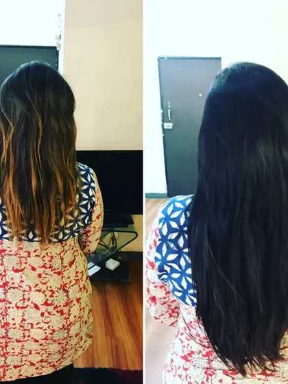 This client's hair was transformed from a natural brown to a darker shade with added length for a dramatic new look.