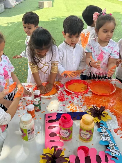 A group of our little stars completely absorbed in the sensory experience of playing with colors. Our Holi celebration is all about safe, hands-on fun.