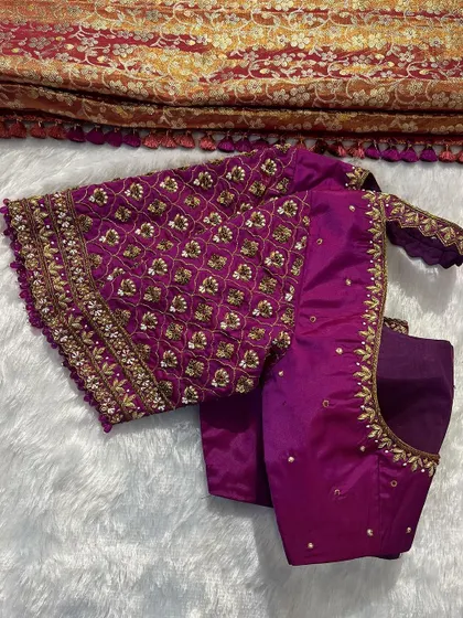 A gorgeous purple bridal blouse with heavy, traditional embroidery, ordered by a client from Shimoga.