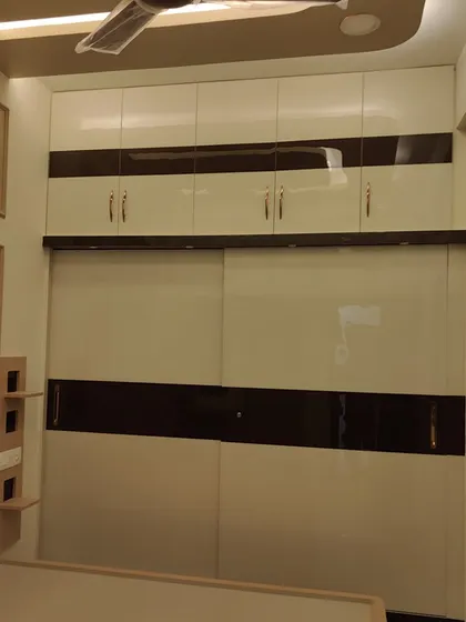 A full view of the finished high-gloss wardrobe, a testament to our meticulous finishing process.