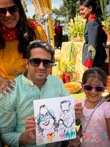 A lovely family portrait, caricature-style. It's always a joy to draw families and see the kids' excitement.