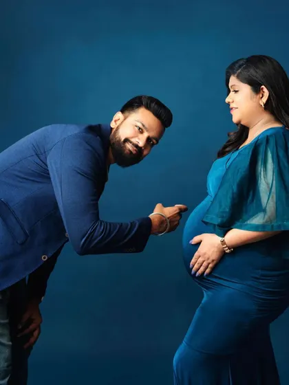 A playful and sweet moment as the dad-to-be points to the bump. It’s these fun, candid interactions that make a session so memorable.