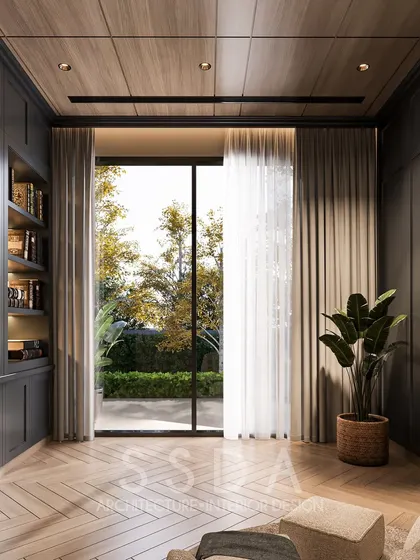In this view of the study, the built in bookshelf adds a sense of warmth and character. The large glass opening ensures the room, despite its dark palette, feels connected to the outdoors, making it a perfect space for contemplation and relaxation.