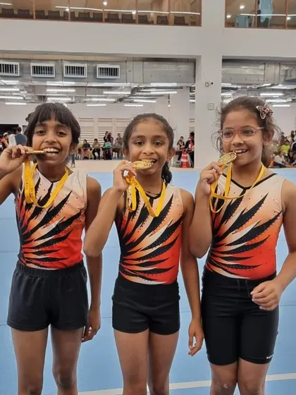 The pure joy of achievement. My students proudly show off their gold medals after a successful competition, a testament to their perseverance and skill.