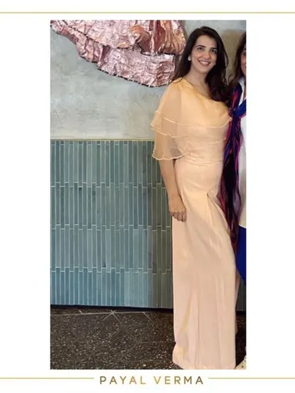 A client wearing a lovely blush pink co-ord set. This elegant outfit features delicate organza frills on the shoulders, making it a perfect choice for brunches, dinners, or get-togethers.