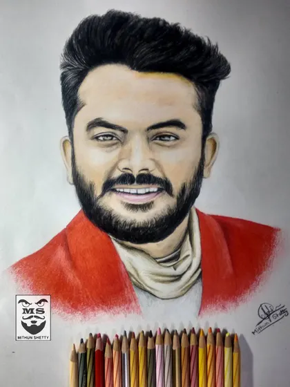 This is a color pencil sketch of Kannada rapper Chandan Shetty. I used a vibrant red for his jacket to make the portrait pop and carefully blended skin tones for a realistic finish.