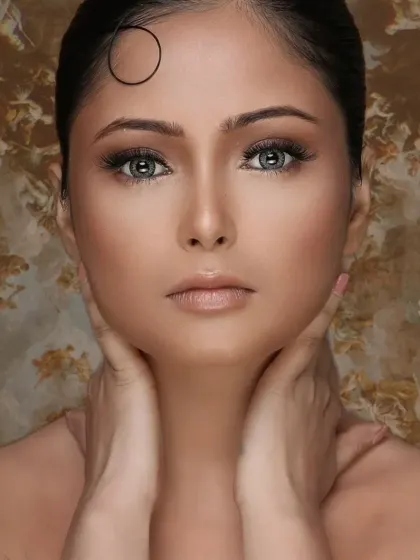 A direct, full-face view of the makeup on a medium skin tone, showing the seamless blending and clean application.
