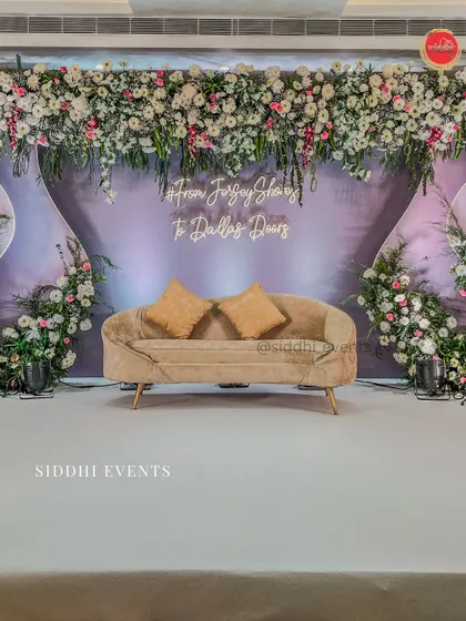 We brought this couple's long-distance love story to life with a personalized neon sign and a modern, elegant stage design, blending soft lavender with lush florals for their engagement.