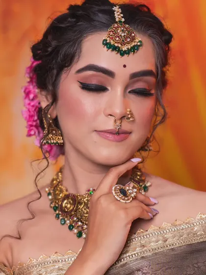 The model's serene expression perfectly complements the elegant jewellery.