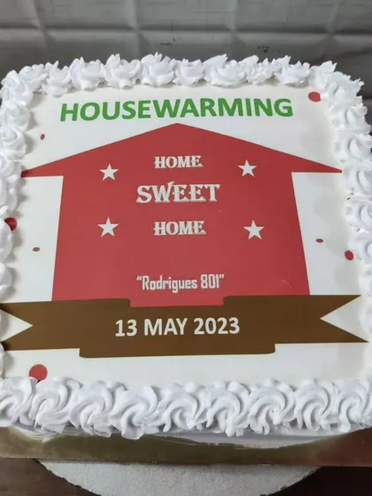 A housewarming cake to celebrate a new home. This custom photo cake features a "Home Sweet Home" design with the family's address.