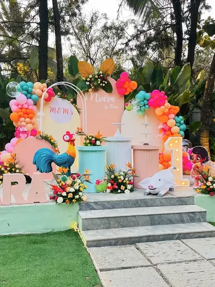 A vibrant, tropical Moana-themed party for a first birthday. We used bright colors, floral arrangements, and character cutouts like Heihei and Pua to bring the island of Motunui to life.