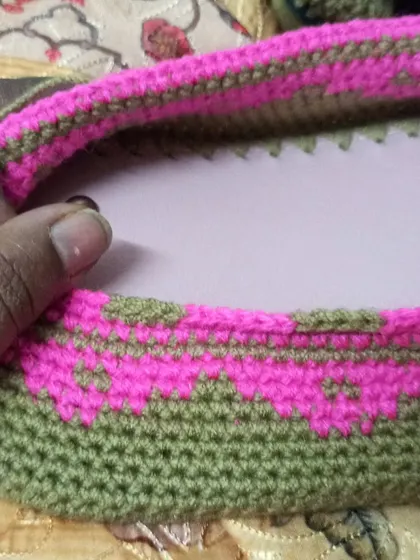 A close-up of the drawstring channel being created for the backpack, ensuring a secure closure.