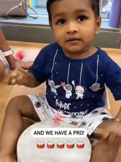 Look at this pro. With a drum and a stick, he is completely in his element, feeling the rhythm. It’s amazing to see how naturally children take to making music.