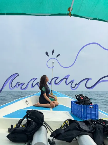 Sitting on a boat, dreaming of the waves. I drew some simple purple waves to represent the calm of the ocean.