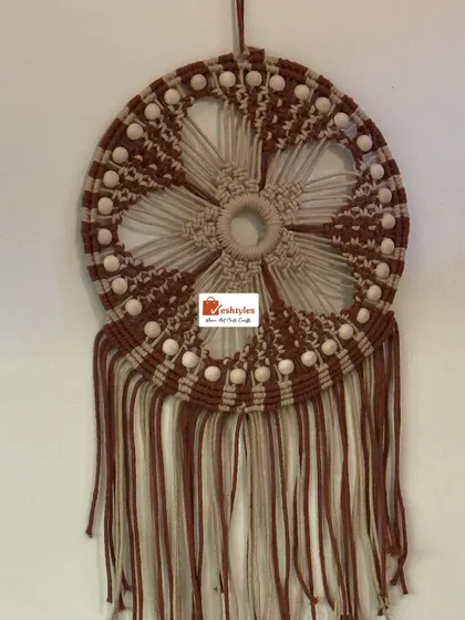 Another view of my brown and beige floral dreamcatcher. The intricate knotting and wooden beads create a beautiful, detailed design.