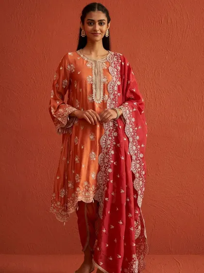 A full look at the Kangna Burnt Orange Kurta Set with its stunning red embroidered dupatta.