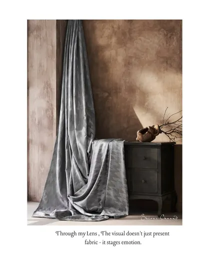Through my lens, the visual doesn't just present fabric, it stages emotion. The rich texture of the velvet and the dramatic lighting create a scene that feels both luxurious and intimate.