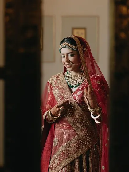 A quiet moment captured as bride Tanya gets ready. The soft lighting and her calm expression create a beautiful and intimate portrait before the ceremony begins.